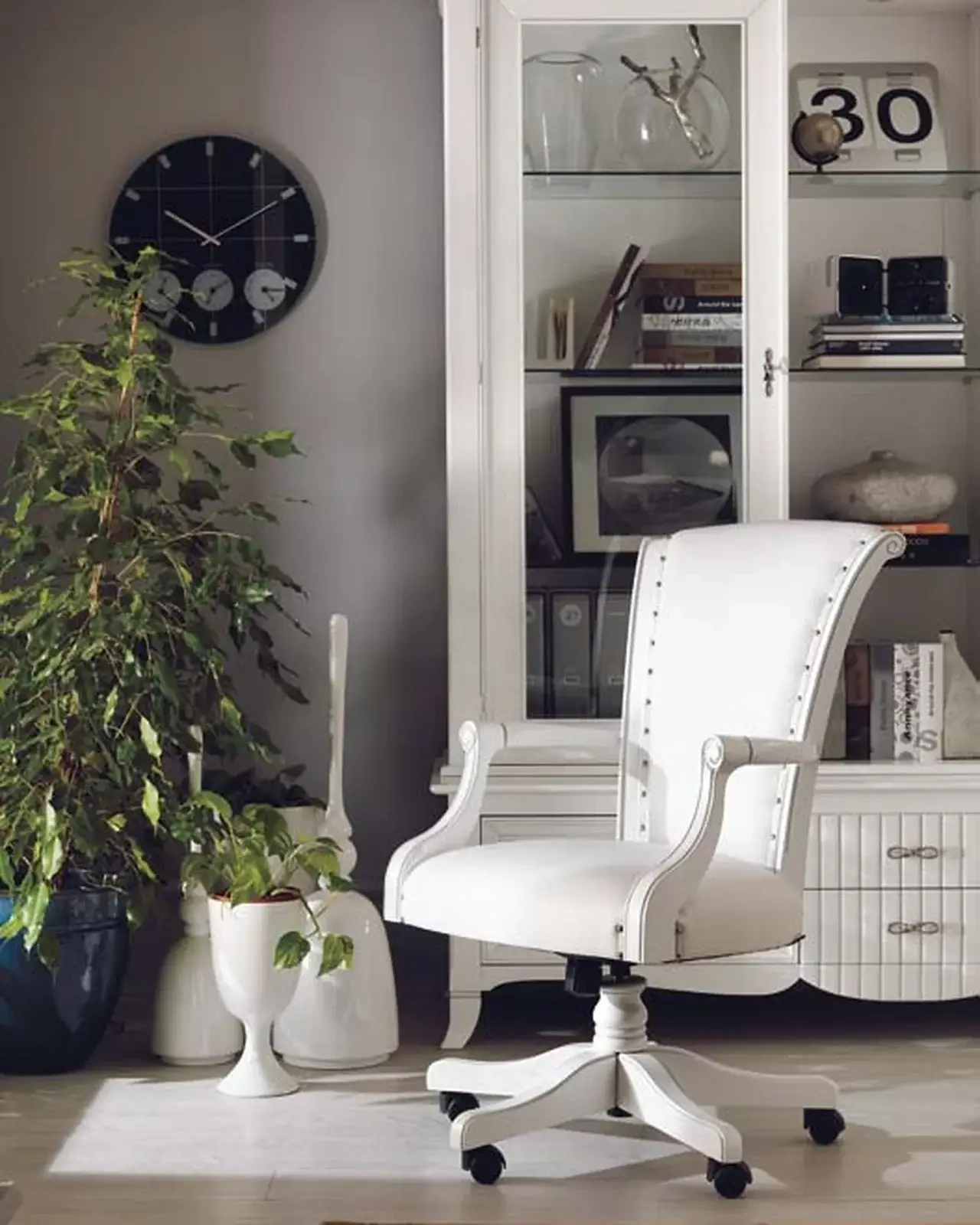 New Deco Swivel Armchair in Leather, a leather swivel armchair on a solid cherry frame
