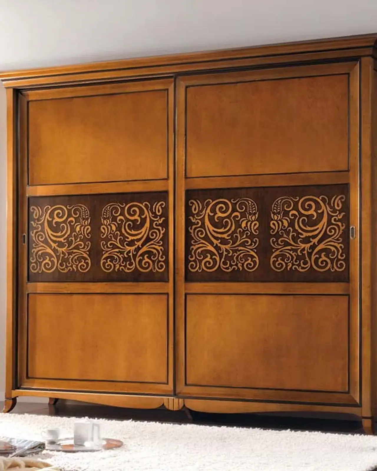 New Deco luxury wardrobe by Francesco Pasi with bicolour sliding doors on a solid cherry frame