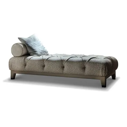 Elegant Masami chaise longue offering a sculptural profile and high-end comfort for a relaxation area.